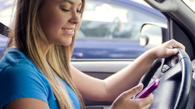 15862-a-teen-girl-texting-while-driving-pv